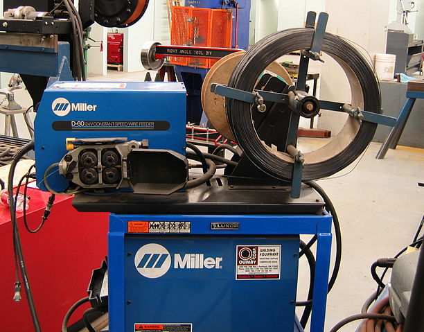 File:Welding wire feeder-Miller-D60-side-triddle.jpg