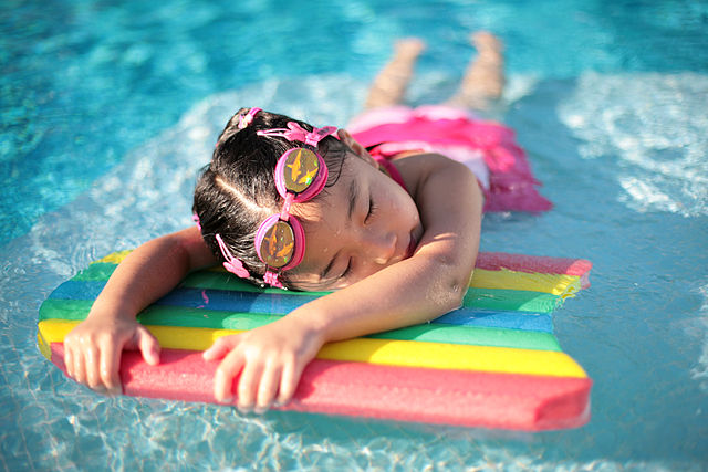 File:Girl with styrofoam swimming board.jpg