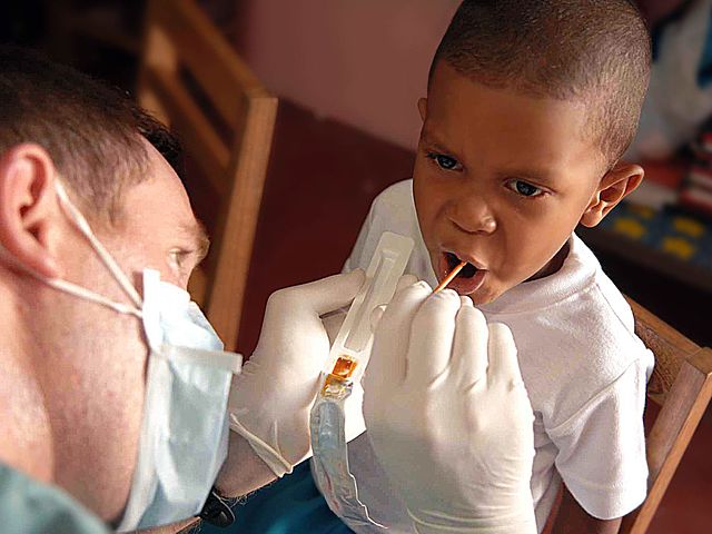 File:US Navy 090526-F-1333S-023 A service member embarked aboard the Military Sealift Command hospital ship USNS Comfort (T-AH 20) gives a Fluoride treatment to a patient during a Continuing Promise 2009 medical civil service projec.jpg
