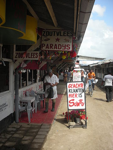 File:Butcher Paramaribo market.jpg